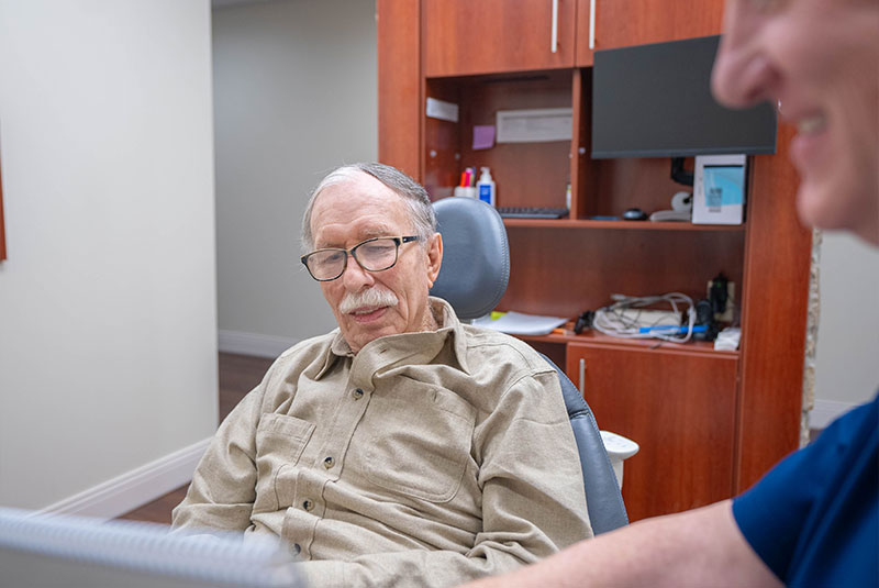 doctor going over dental procedures with patients