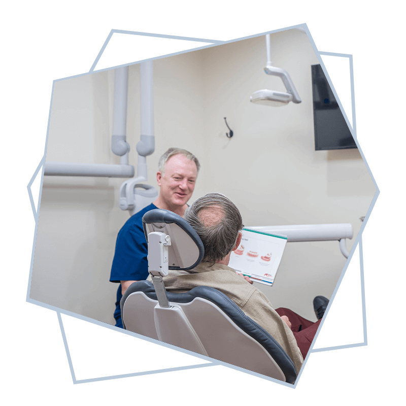 doctor going over different type of dental implants with patient