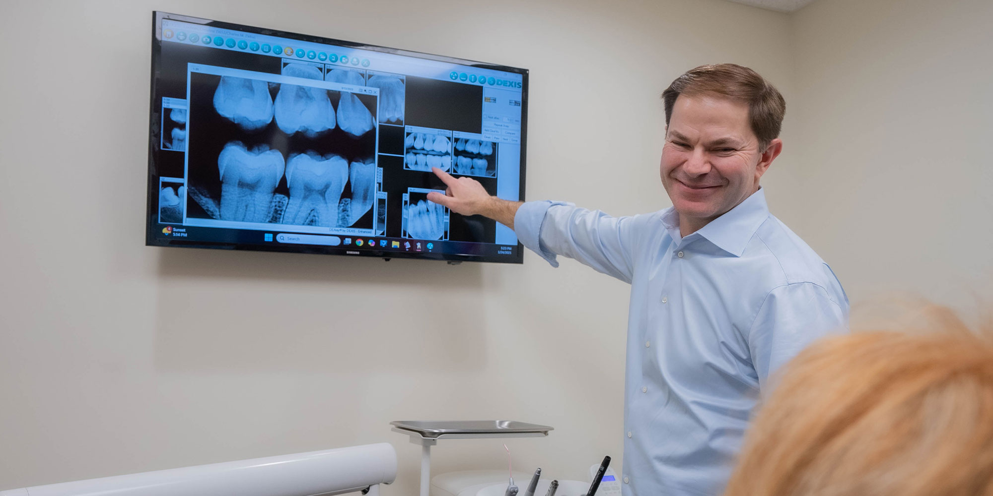 doctor going over x-ray with patient