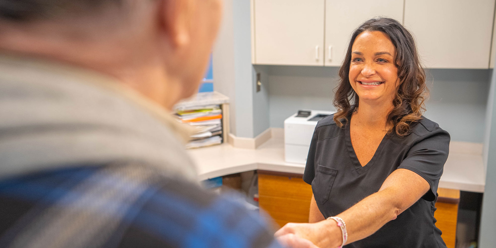 team member going over cost of dental implants